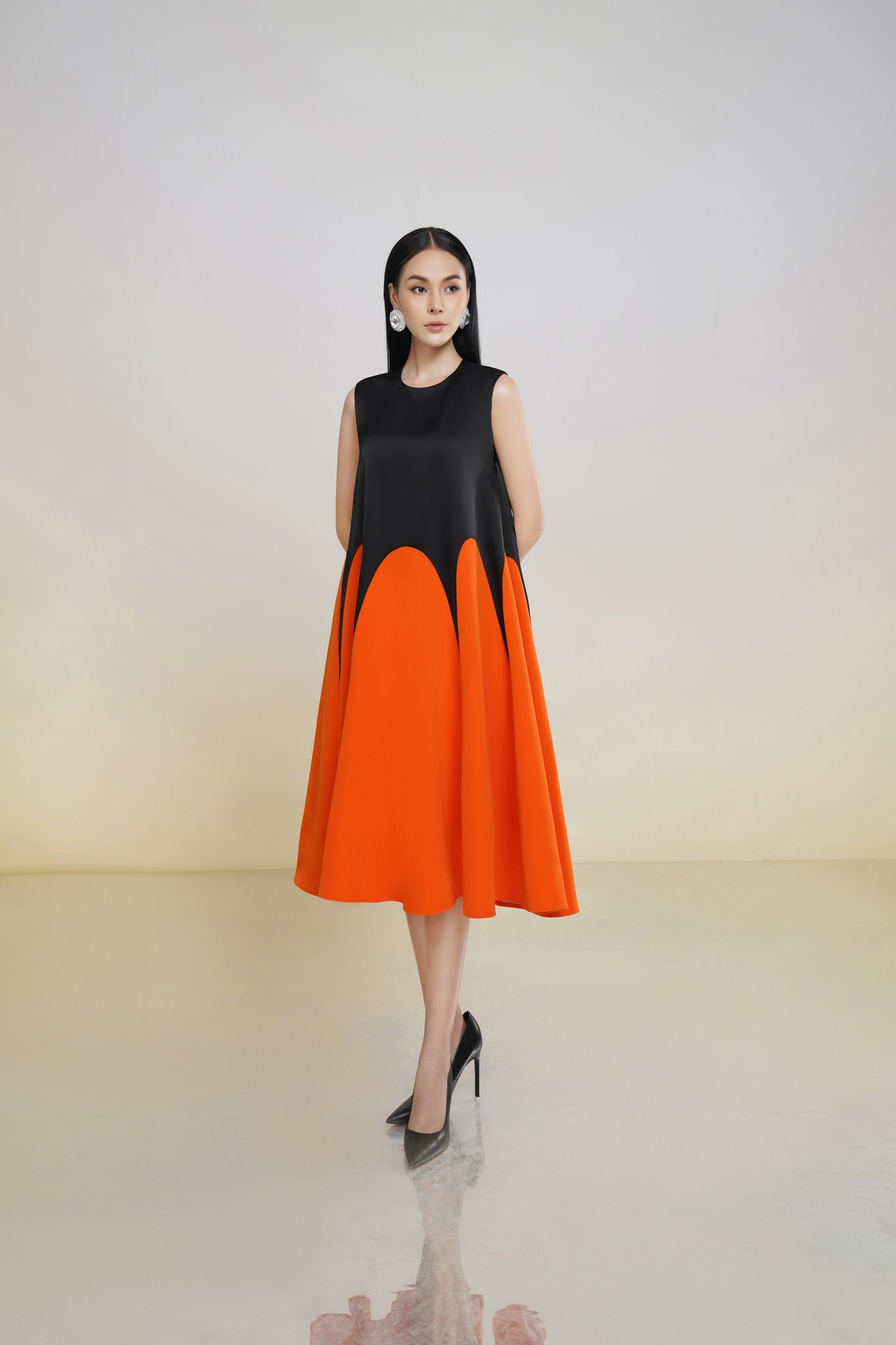 Sleeveless Black and Orange A-Line Midi Dress with Colorblock Design