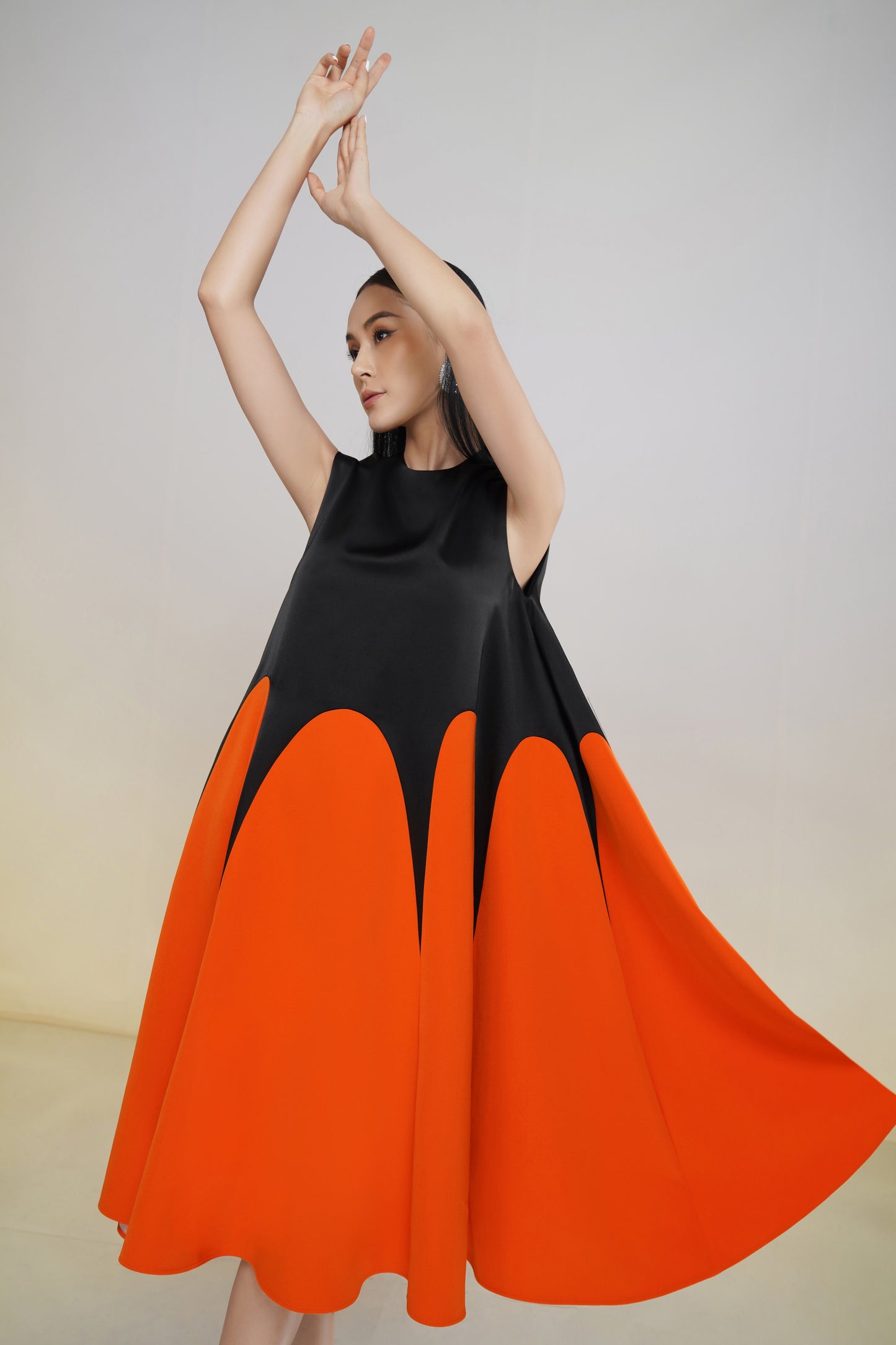 Sleeveless Black and Orange A-Line Midi Dress with Colorblock Design