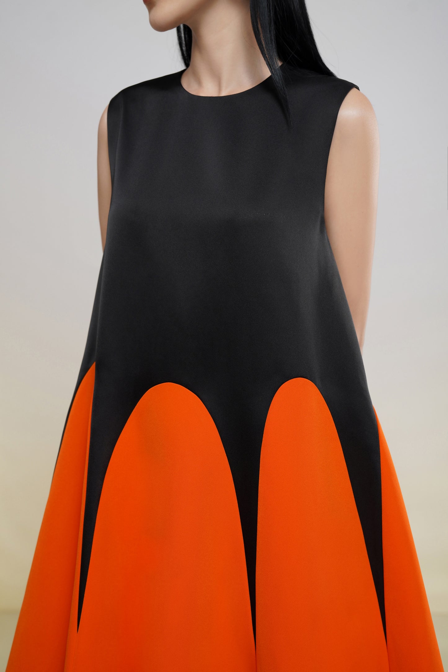 Sleeveless Black and Orange A-Line Midi Dress with Colorblock Design