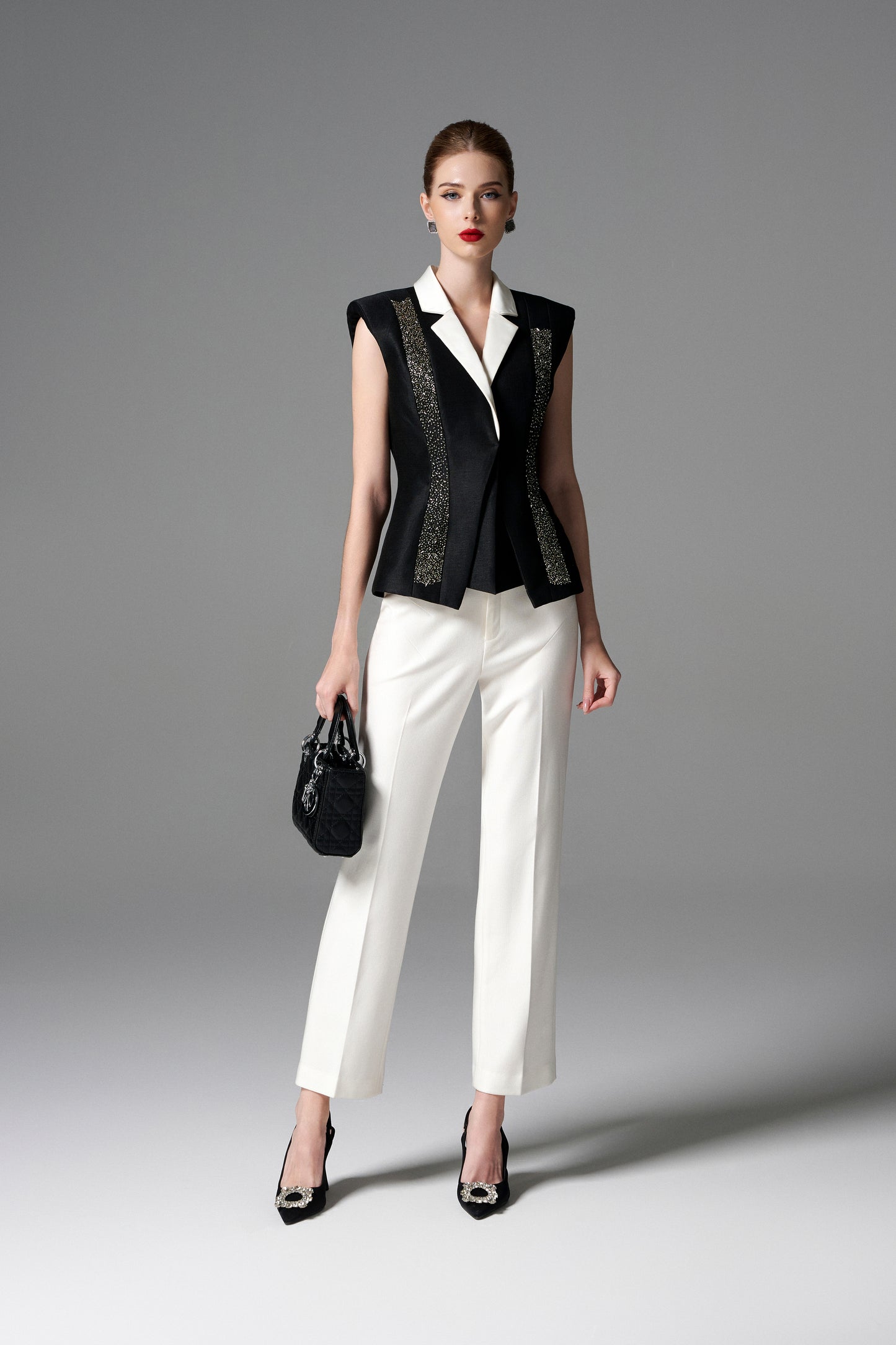 Black and White Sleeveless Blazer with Embellished Accents and Wide-Leg Trousers