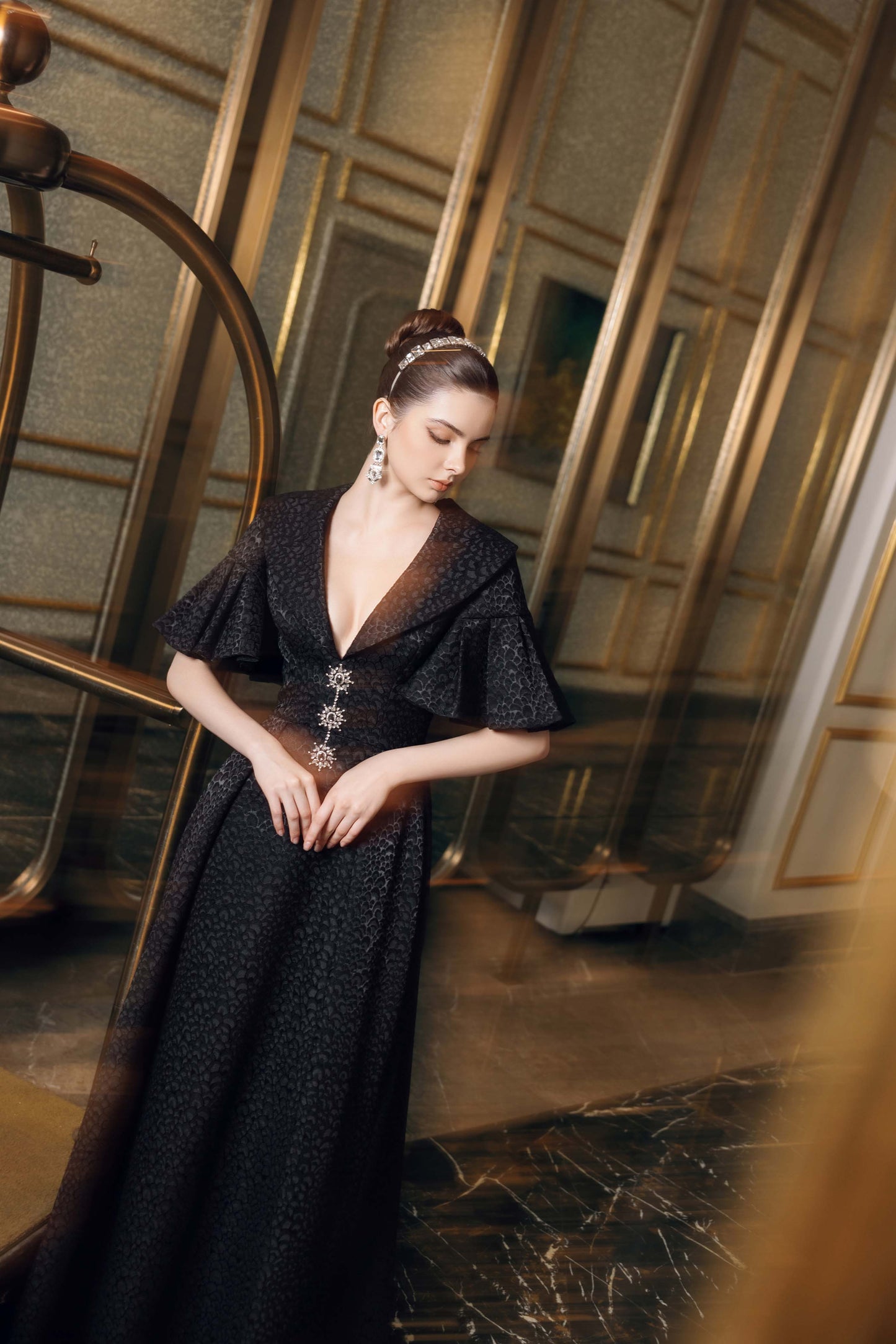 Black Evening Gown with Flared Sleeves and Embellished Buttons