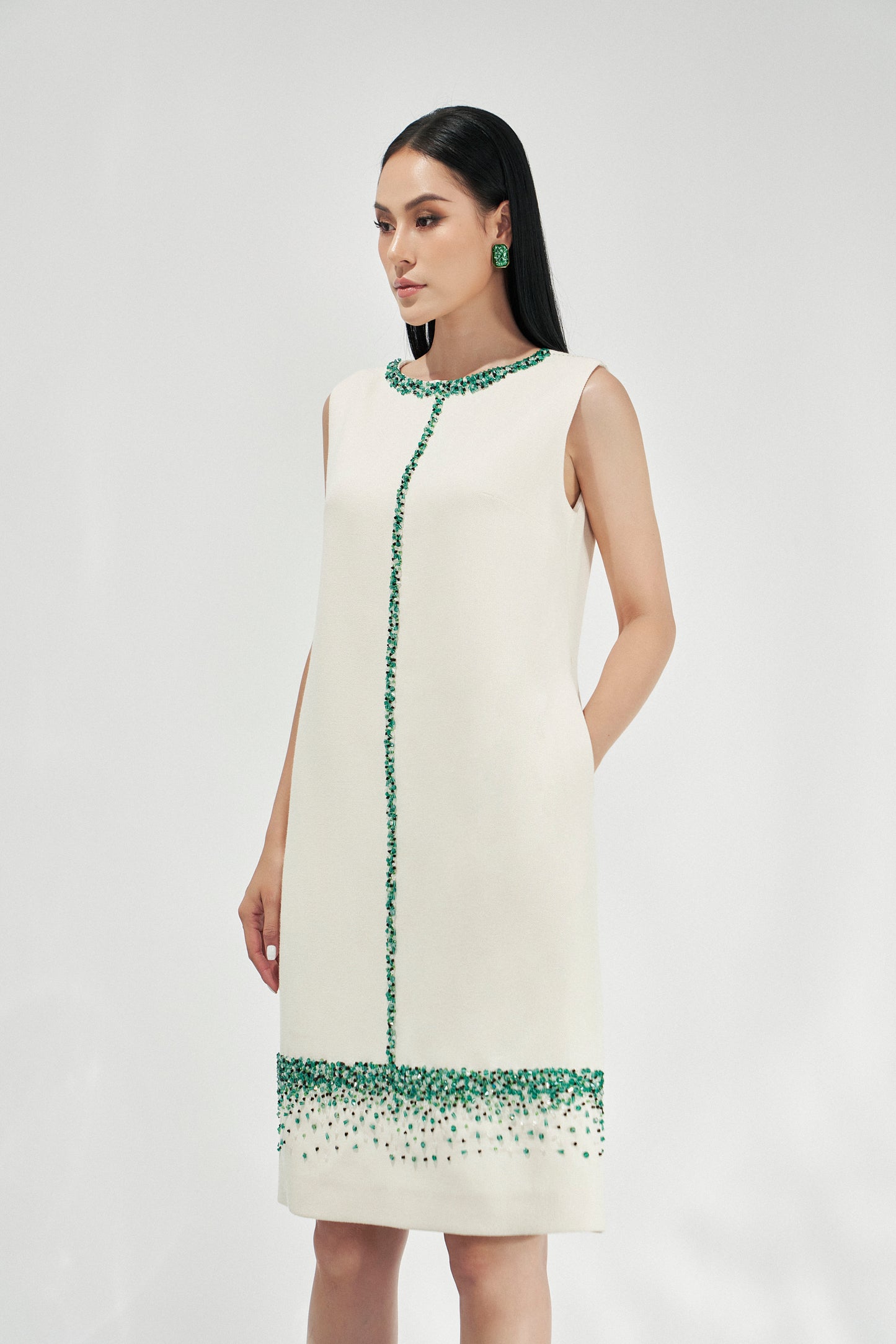 Sleeveless White Shift Dress with Green Gemstone Embellishments