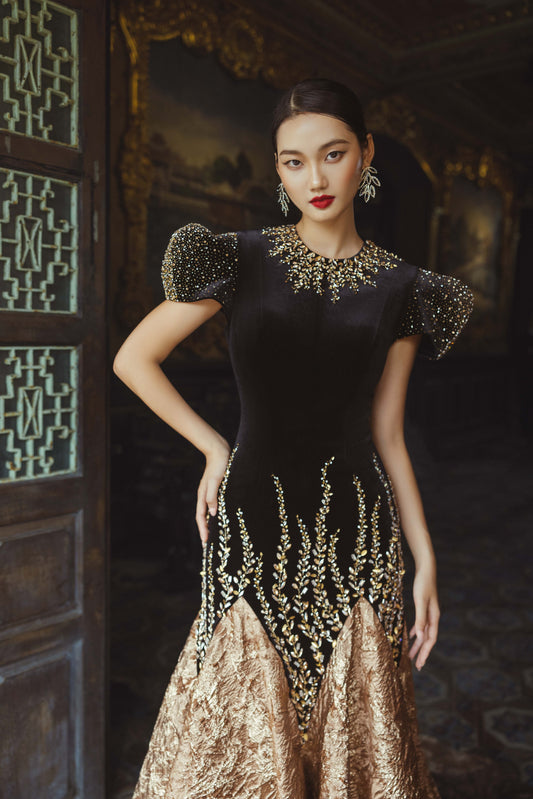 Black and Gold Velvet Gown with Embellished Sleeves and Dramatic Train