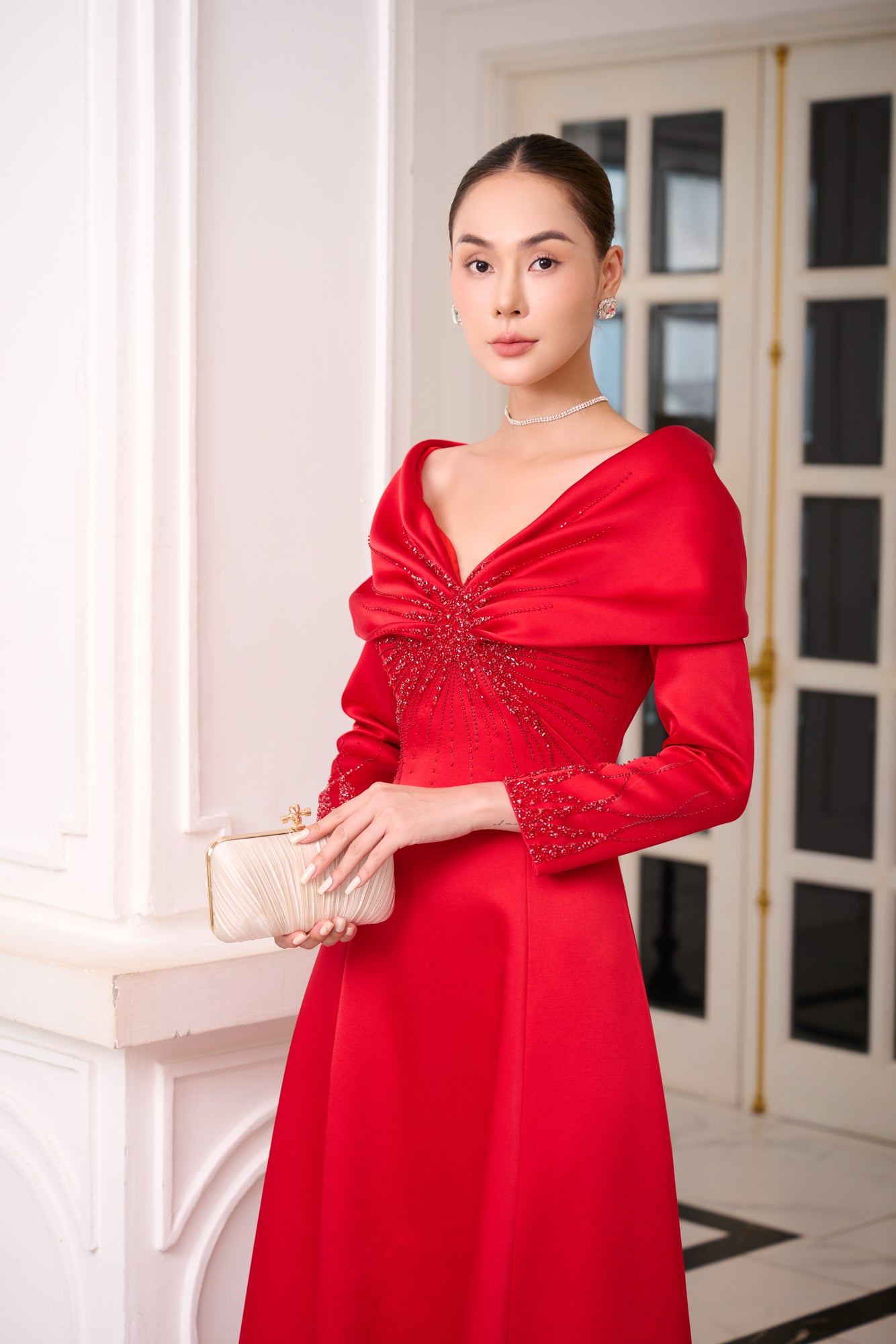 Red Satin Evening Gown with Embellished V-Neck and Long Sleeves