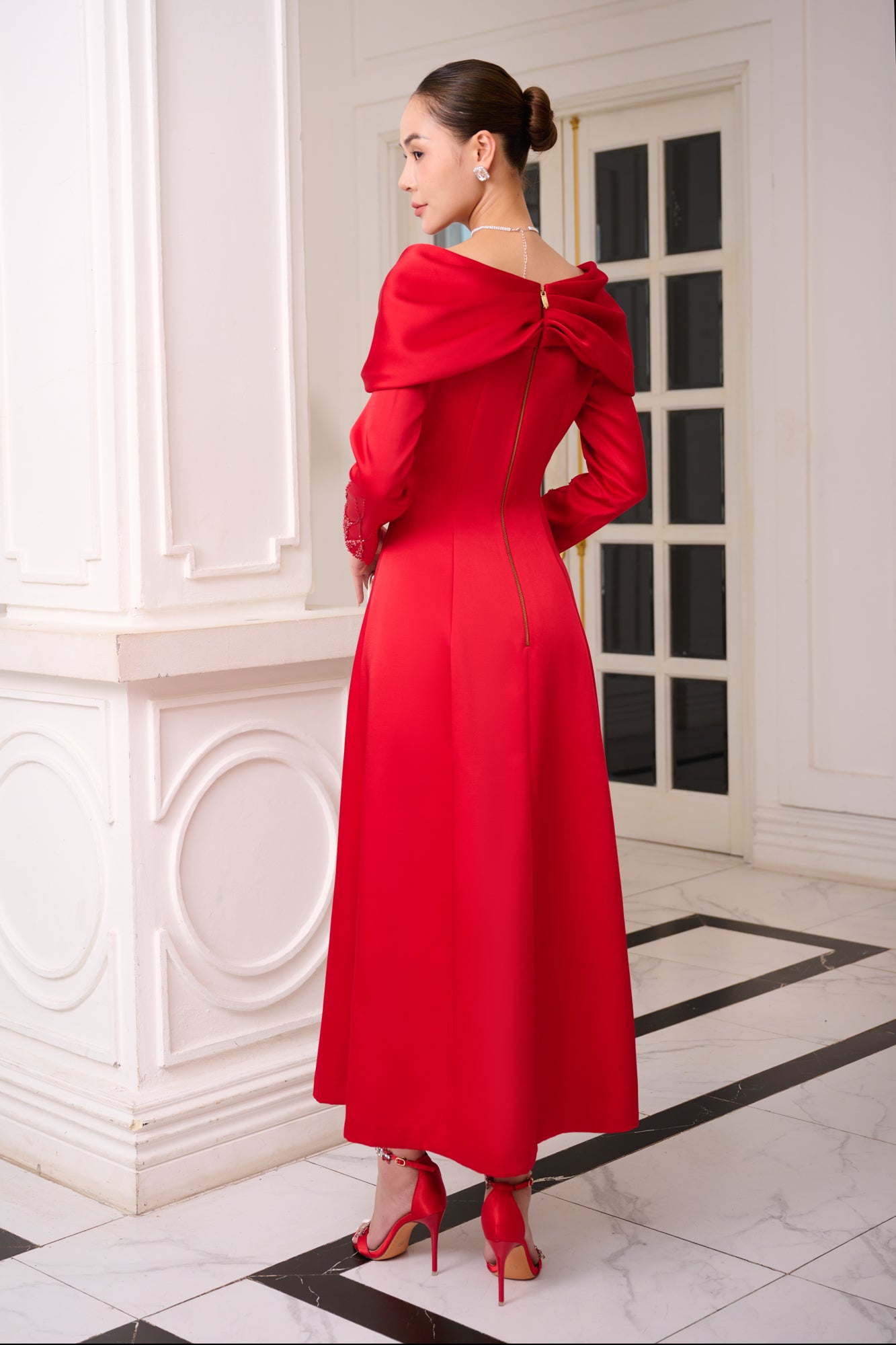 Red Satin Evening Gown with Embellished V-Neck and Long Sleeves