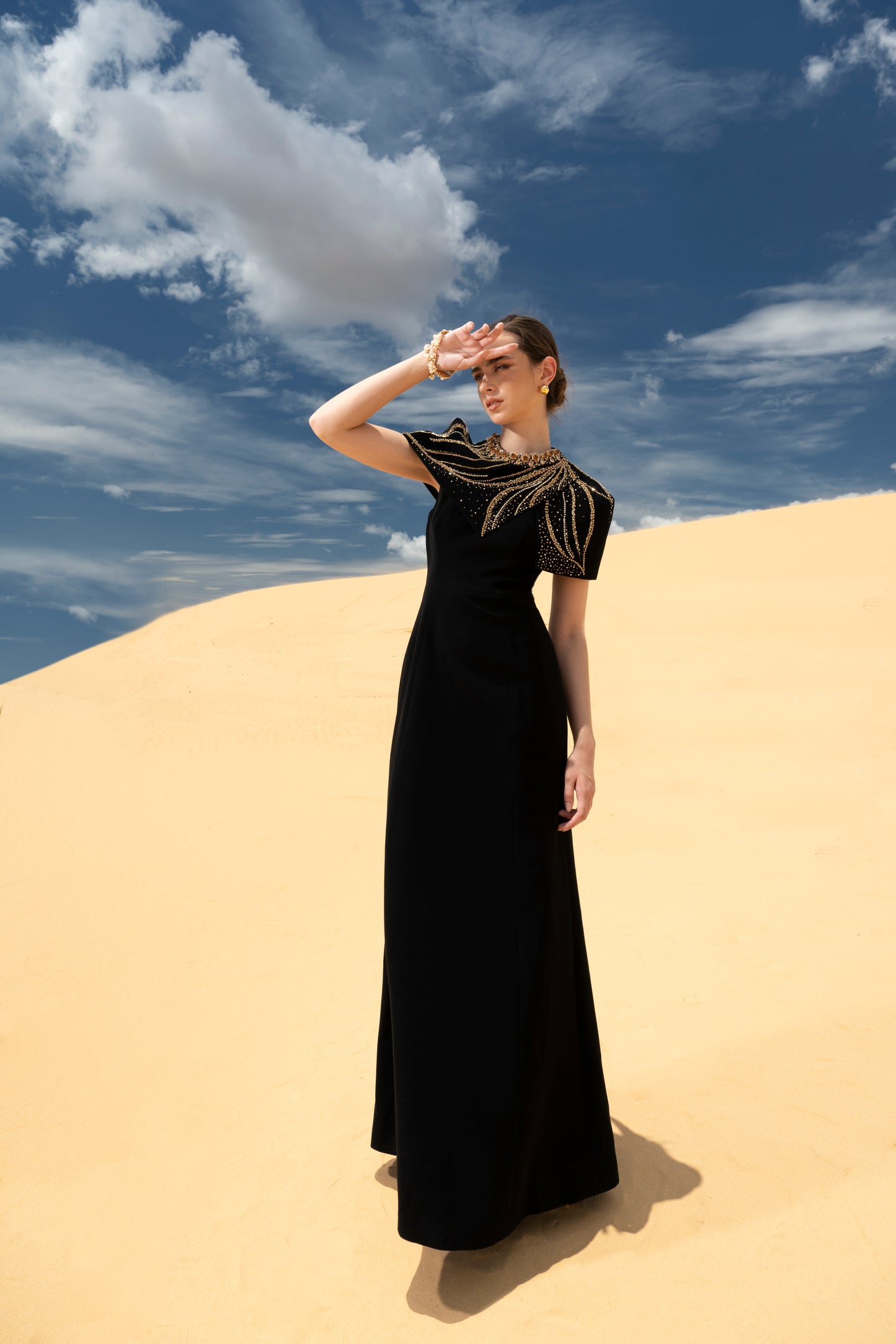 Black Cape-Style Evening Gown with Gold Embellishments