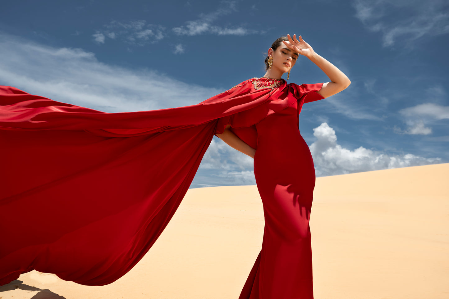 Red Draped Gown with Ornate Gold Embellishments