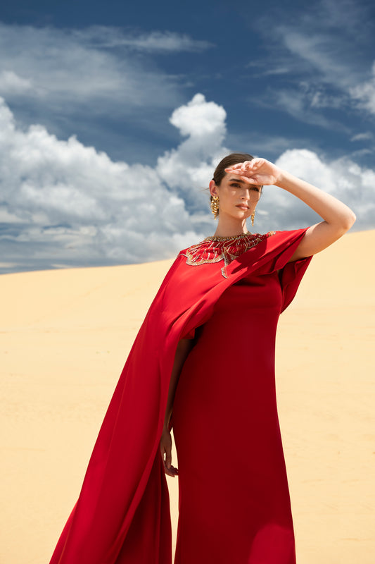 Red Draped Gown with Ornate Gold Embellishments