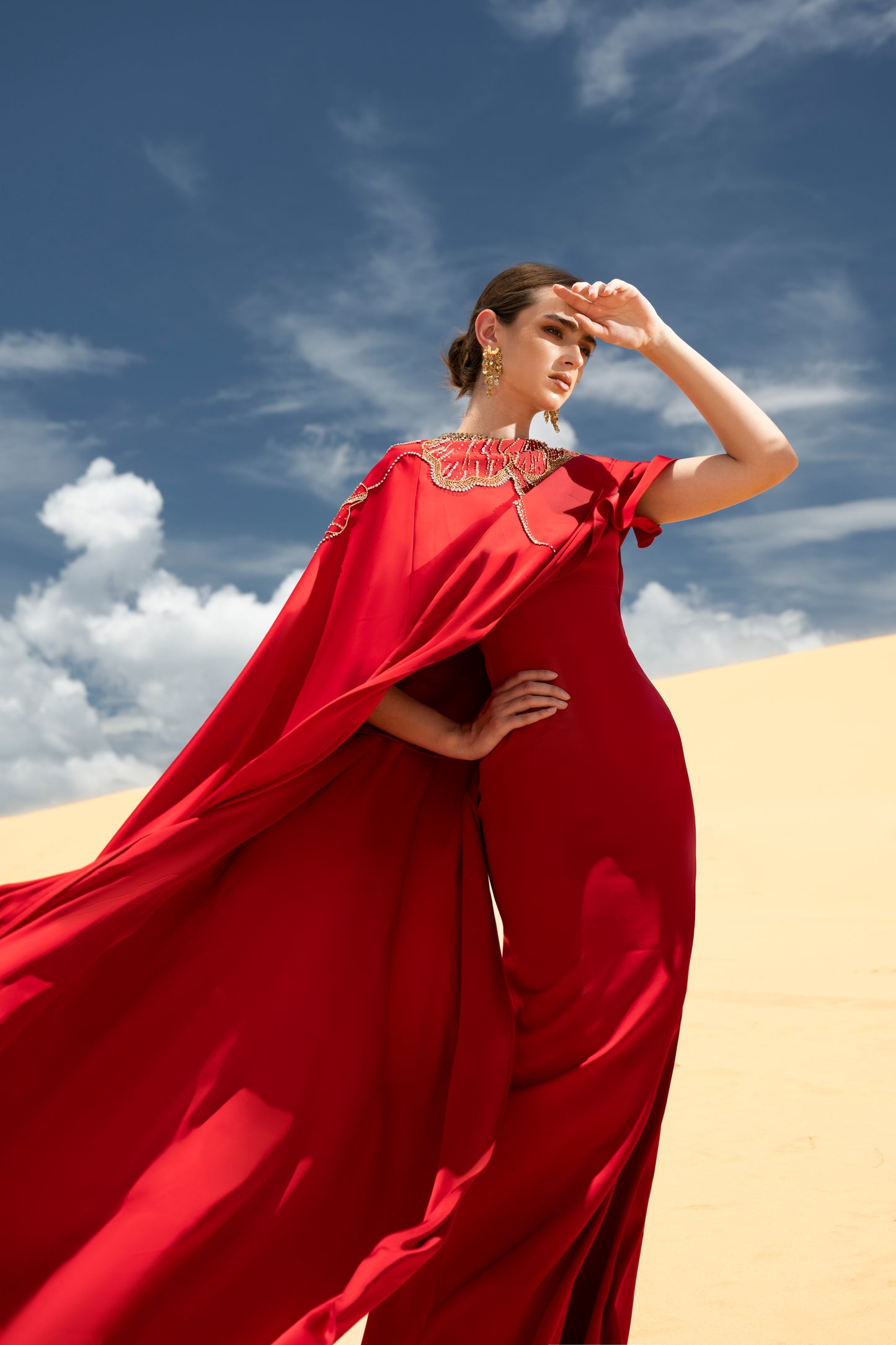 Red Draped Gown with Ornate Gold Embellishments