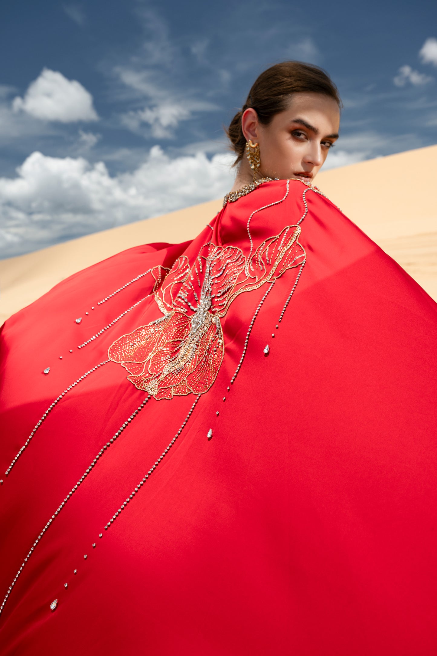 Red Draped Gown with Ornate Gold Embellishments