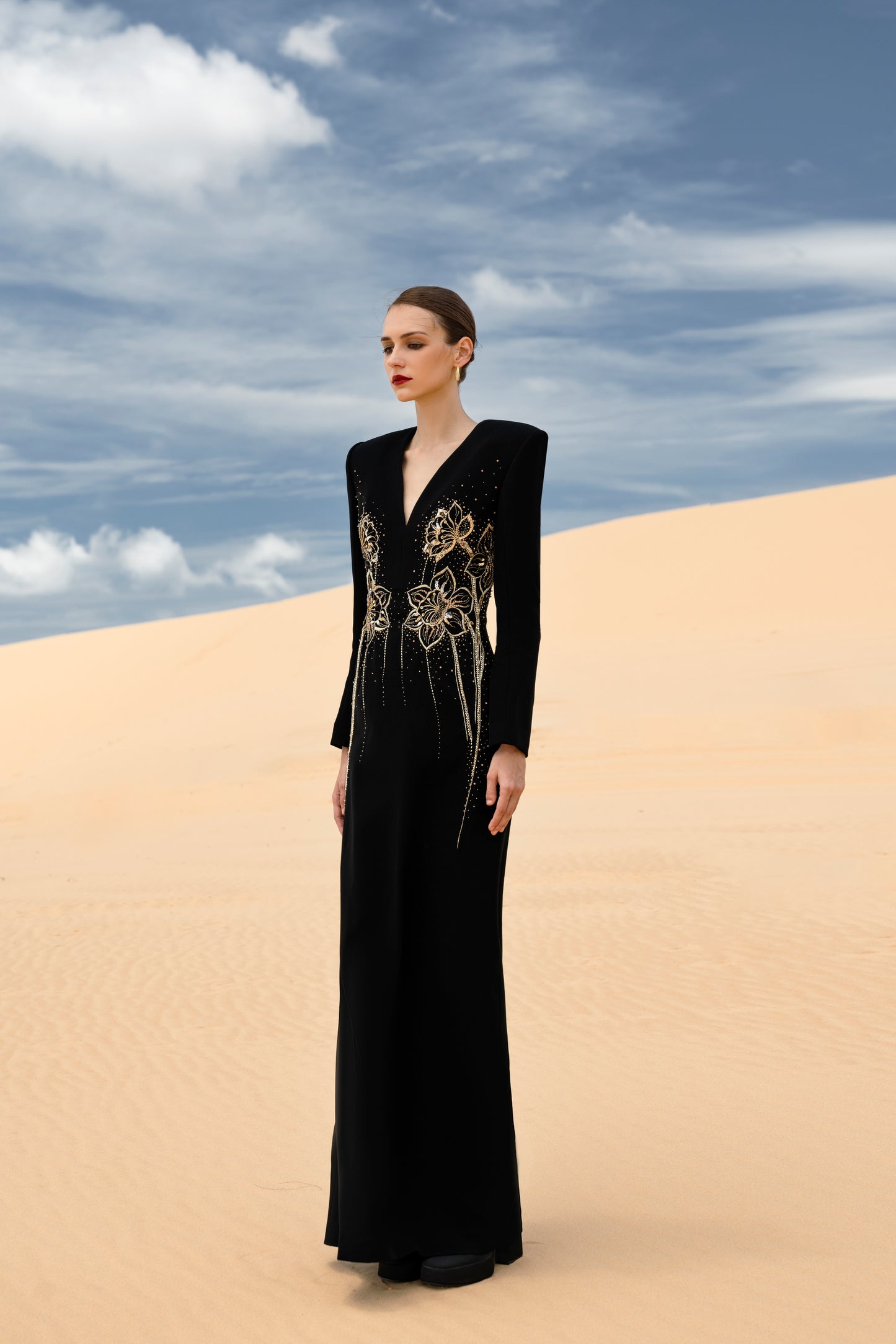 Black Long-Sleeve Gown with Gold Embellished Floral Design and V-Neckline