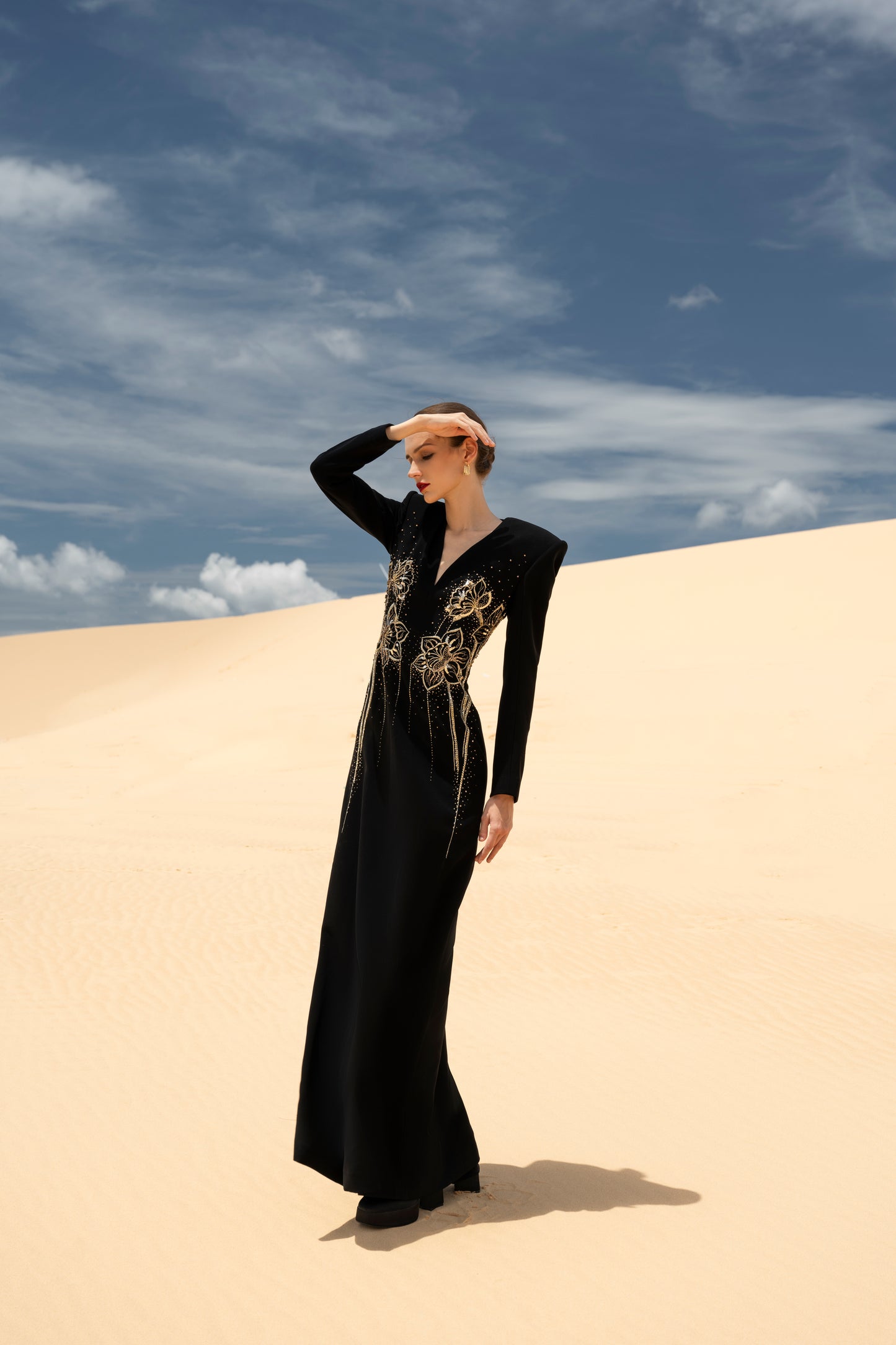 Black Long-Sleeve Gown with Gold Embellished Floral Design and V-Neckline