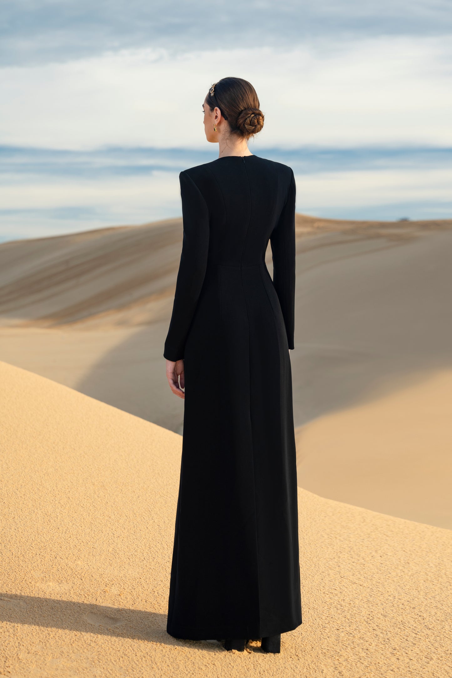 Black Floral Embellished Gown with Gold Detailing and Long Sleeves