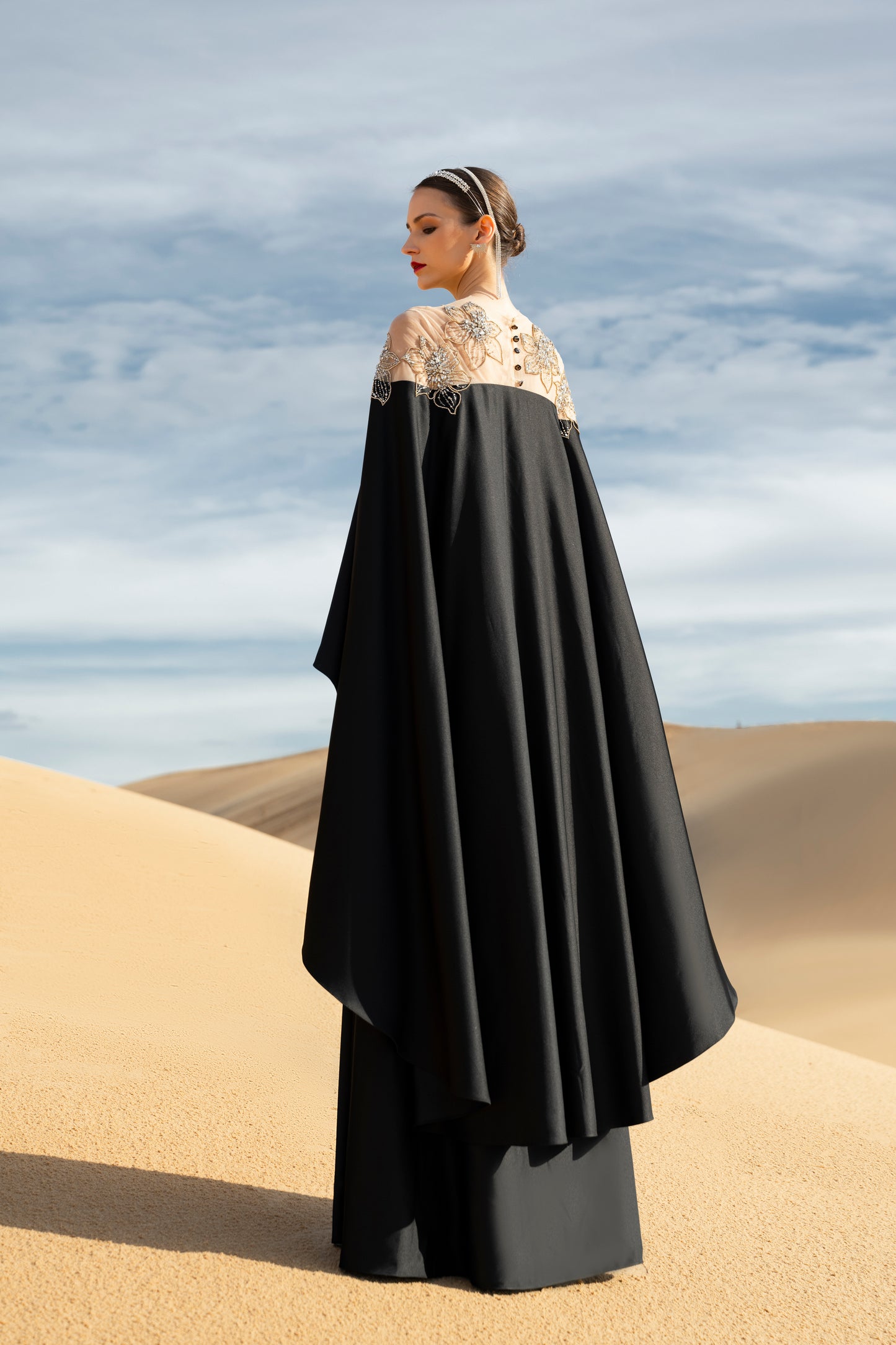 Black Draped Gown with Sheer Embroidered Bodice and Cape Sleeves