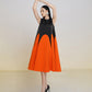 Sleeveless Black and Orange A-Line Midi Dress with Colorblock Design
