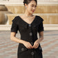 Elegant Black Midi Dress with Vintage Rhinestone Buttons and Beaded Accents