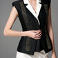 Black and White Sleeveless Blazer with Embellished Accents and Wide-Leg Trousers