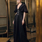 Black Evening Gown with Flared Sleeves and Embellished Buttons