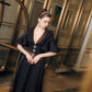 Black Evening Gown with Flared Sleeves and Embellished Buttons