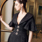 Black Evening Gown with Flared Sleeves and Embellished Buttons