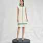 Sleeveless White Shift Dress with Green Gemstone Embellishments