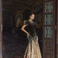 Black and Gold Velvet Gown with Embellished Sleeves and Dramatic Train