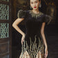 Black and Gold Velvet Gown with Embellished Sleeves and Dramatic Train
