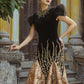 Black and Gold Velvet Gown with Embellished Sleeves and Dramatic Train
