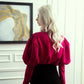 High-Neck Fuchsia Blouse with Puff Sleeves and Black Pencil Skirt