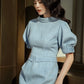 Elegant Light Blue Midi Dress with Puff Sleeves and Belted Waist