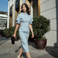 Elegant Light Blue Midi Dress with Puff Sleeves and Belted Waist