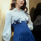 High-Waisted Blue Wide-Leg Jumpsuit with Embroidered White Top