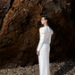 White Long-Sleeve Gown with Intricate Gold Embroidery