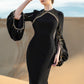 Black Long-Sleeve Gown with Gold Beaded Detailing and Balloon Sleeves