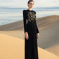 Black Floral Embellished Gown with Gold Detailing and Long Sleeves