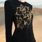 Black Floral Embellished Gown with Gold Detailing and Long Sleeves